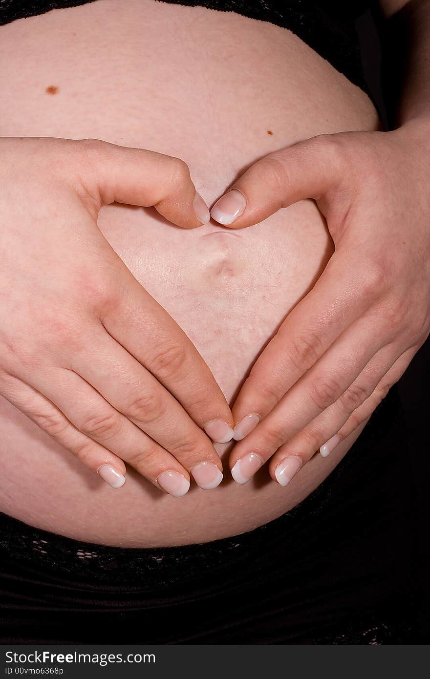 Hands on pregnant belly