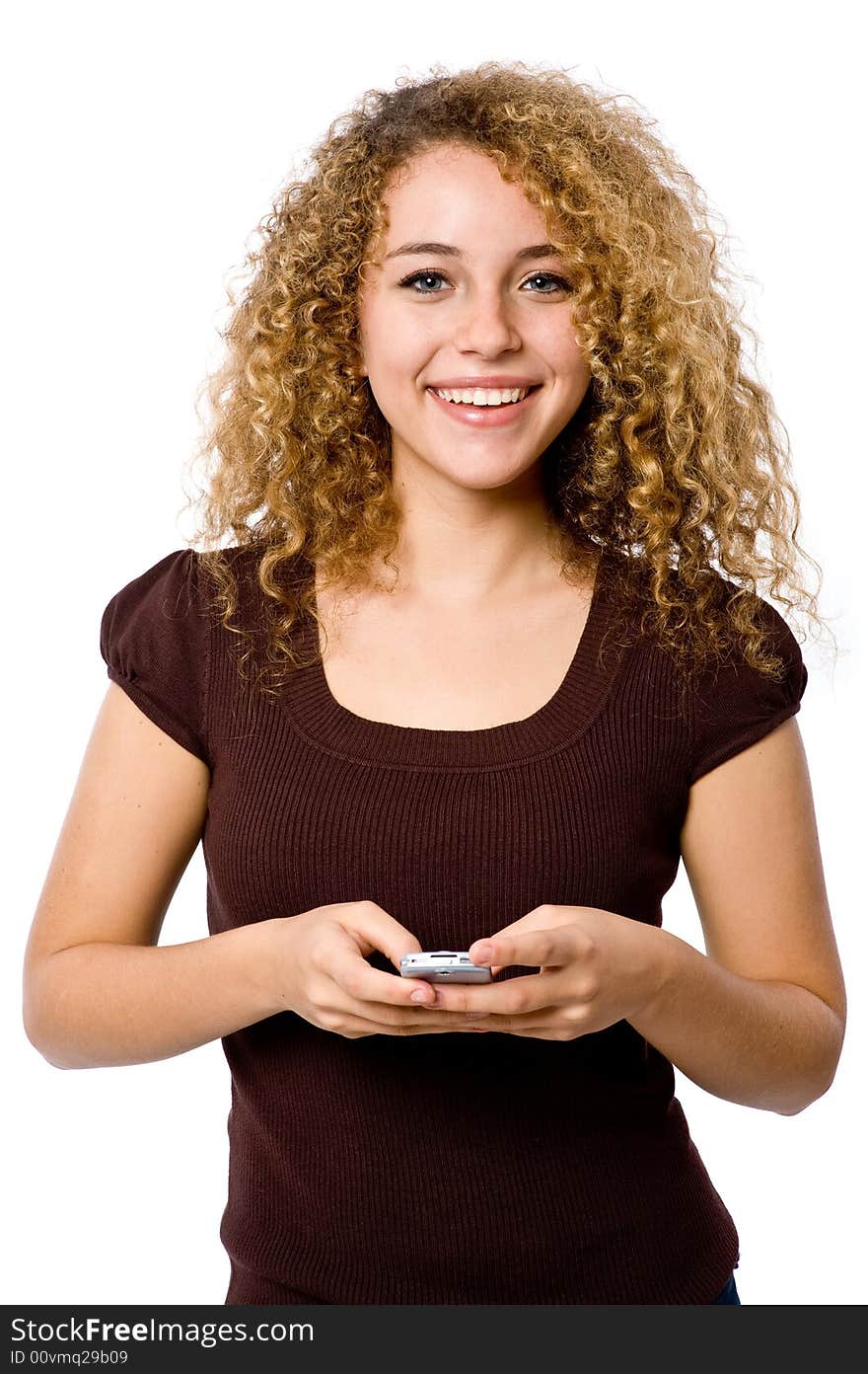 An attractive young woman with mobile phone on white background. An attractive young woman with mobile phone on white background