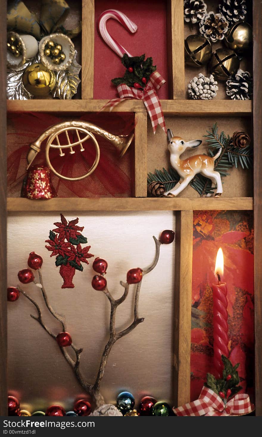 A shadow box full of holiday ornaments