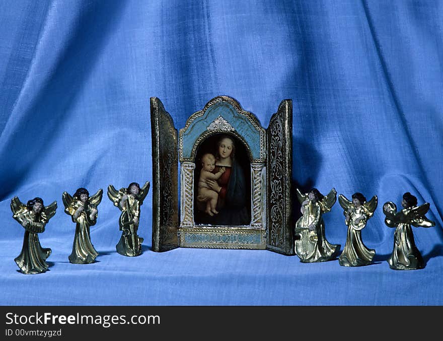 Angels surround a picture of the virgin mary. Angels surround a picture of the virgin mary