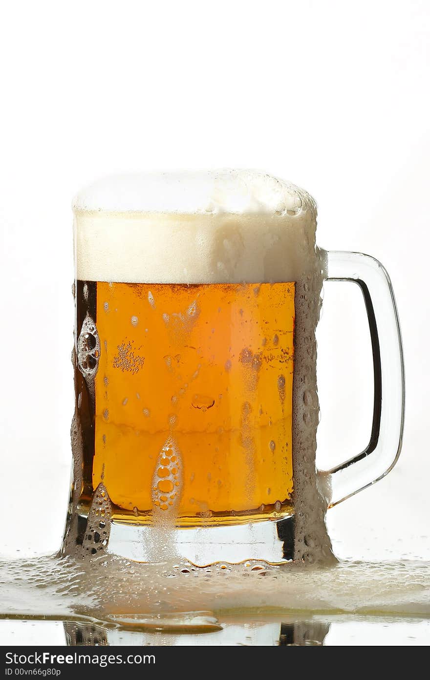 Beer in glass on the white background