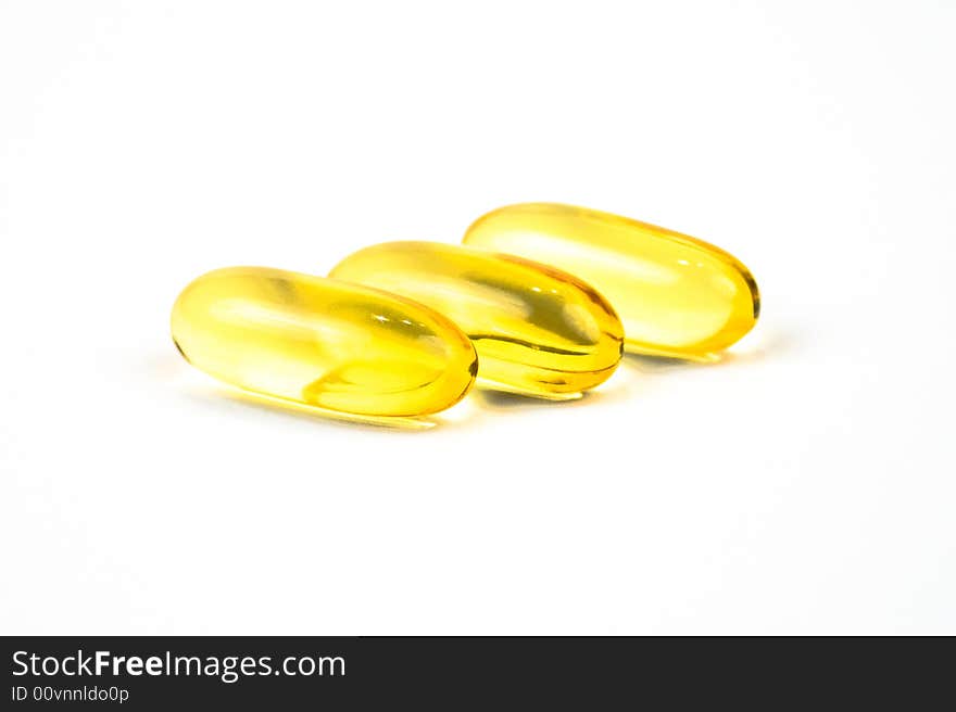 Cod liver oil tablets on a white background