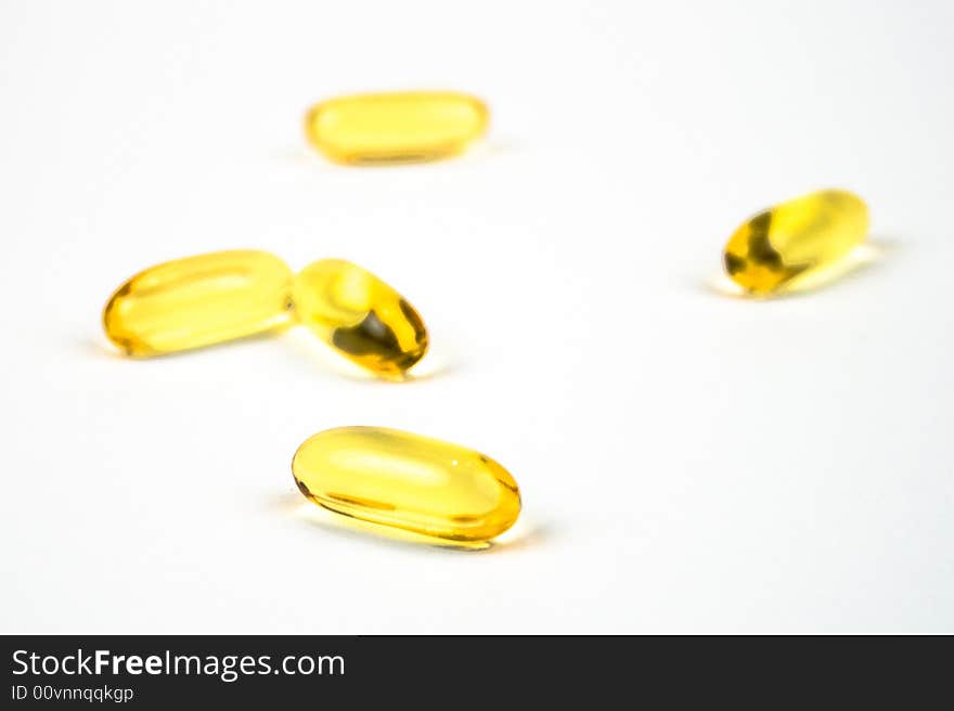 Cod liver oil tablets on a white background