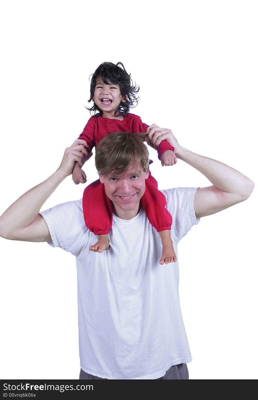 Father carrying laughing son on his shoulders. Father carrying laughing son on his shoulders