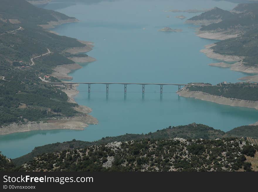 Narrow bridge over a wide river