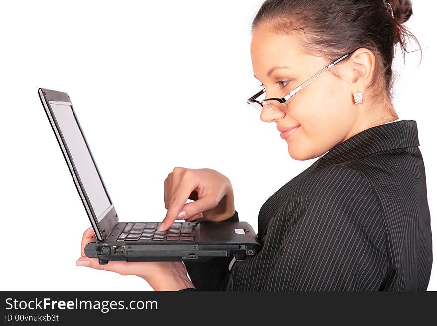 Beautiful girl holds notebook and press key