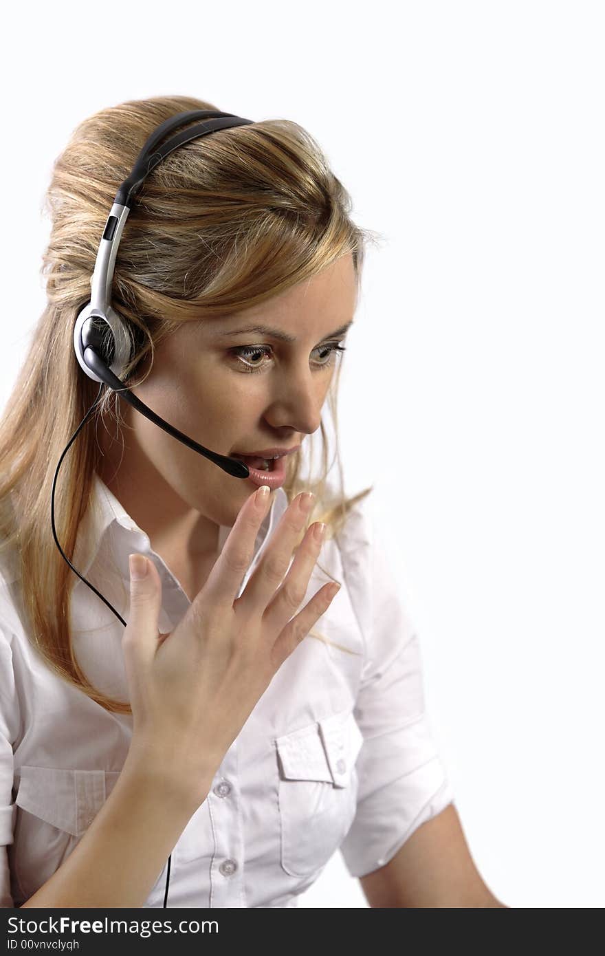 Surprised blonde telephone customer support lady with eyes wide open mouth open and hands covering mouth in disbelief.