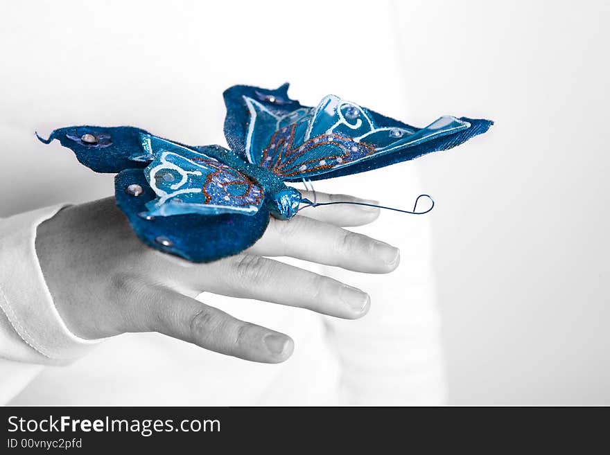 Blue Butterfly In Woman Hand