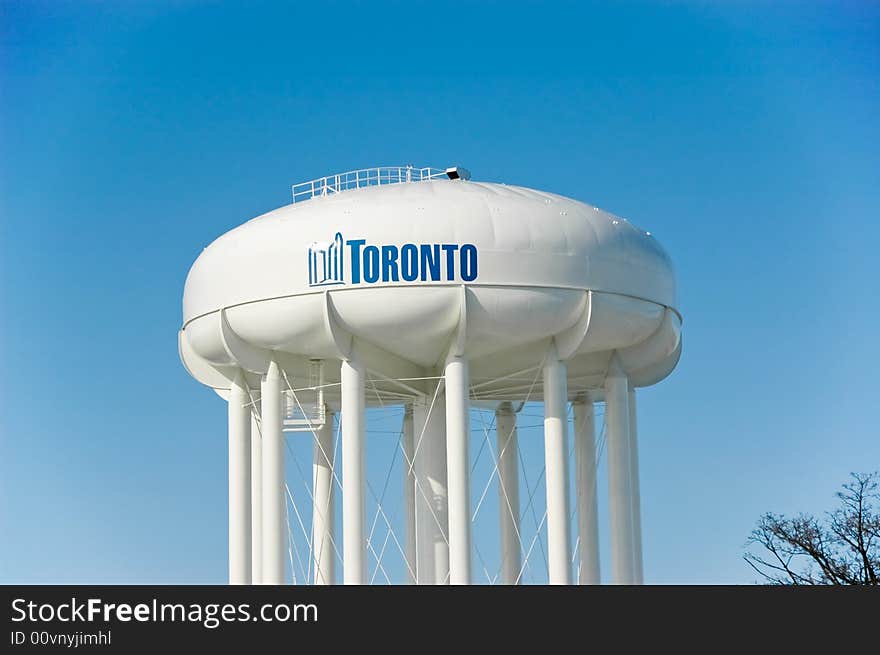 Municipality round water tower and blue sky in the background