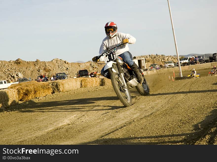 Dirt bike racer on racetrack