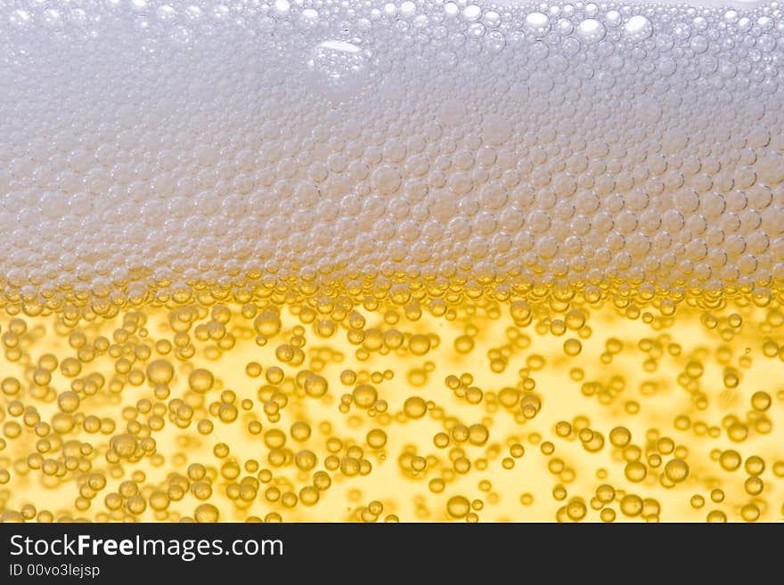 Background from fresh foamy beer with bubbles. Close-up. Background from fresh foamy beer with bubbles. Close-up.