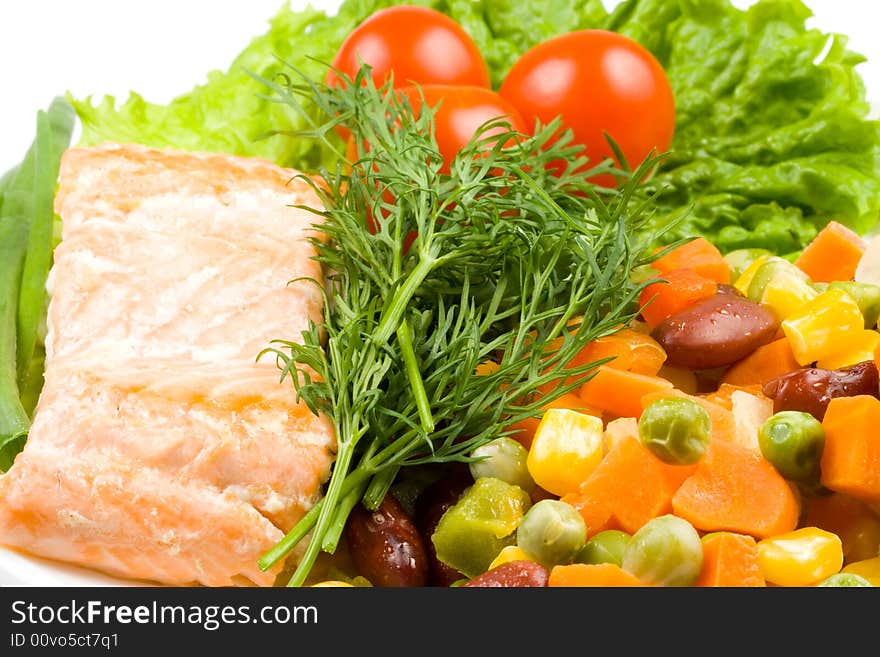 Stake from a salmon with vegetables on a plate