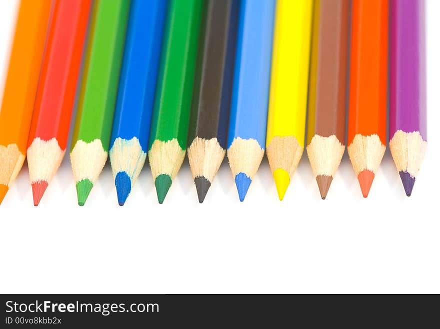 Colored pencils isolated on white background