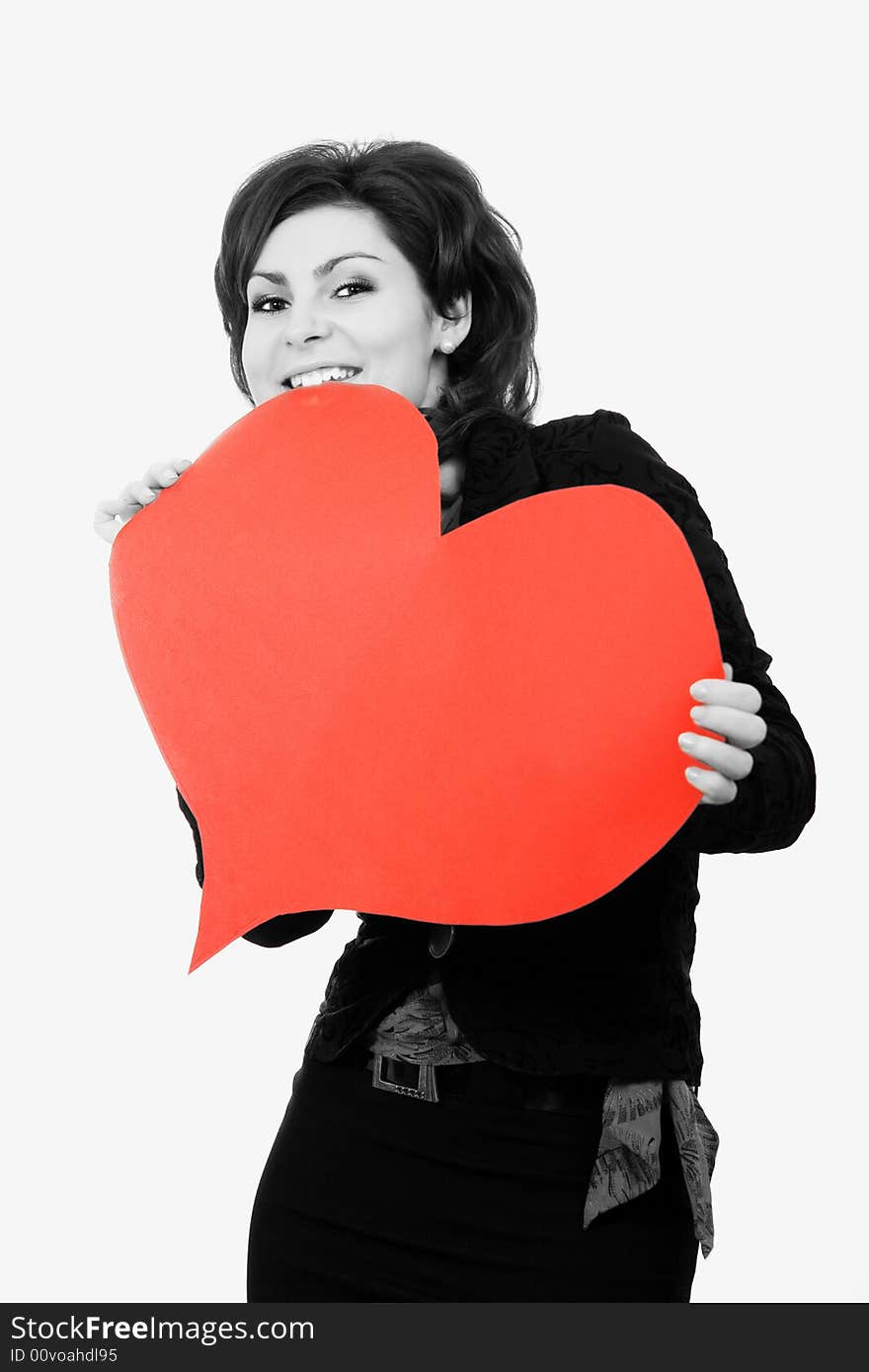 A girl keeps a big red paper heart. A girl keeps a big red paper heart