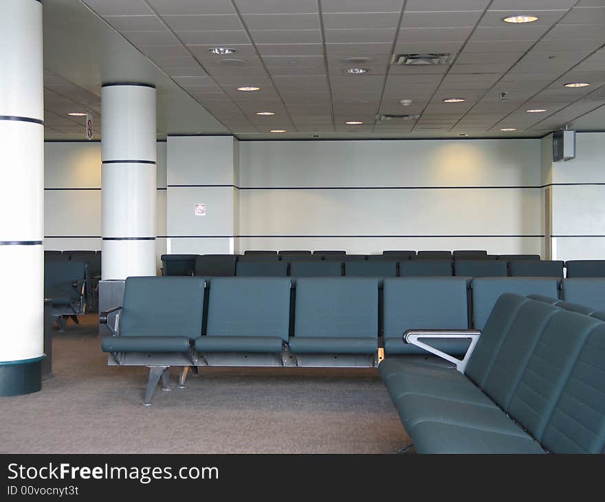 Airport waiting room with green seats