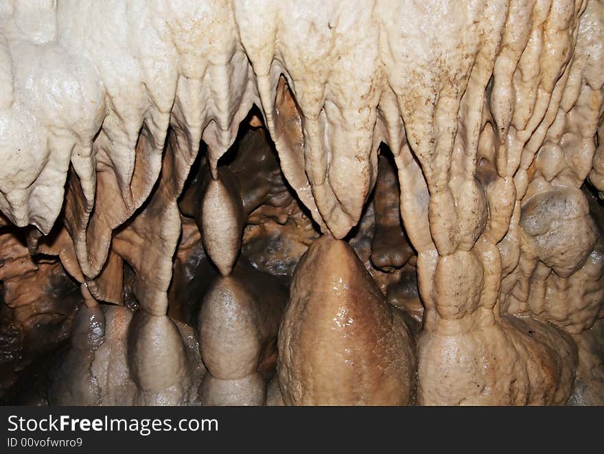 Wet rocks inside of a cave showing years of developement. Wet rocks inside of a cave showing years of developement.