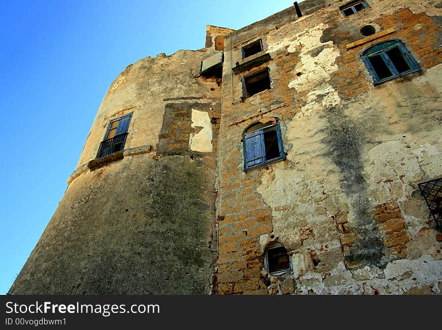 Ancient construction wich name is Tonnara Bordonaro XVI century. builded on the sea coast of Palermo Island of Sicily, Italy. Ancient construction wich name is Tonnara Bordonaro XVI century. builded on the sea coast of Palermo Island of Sicily, Italy