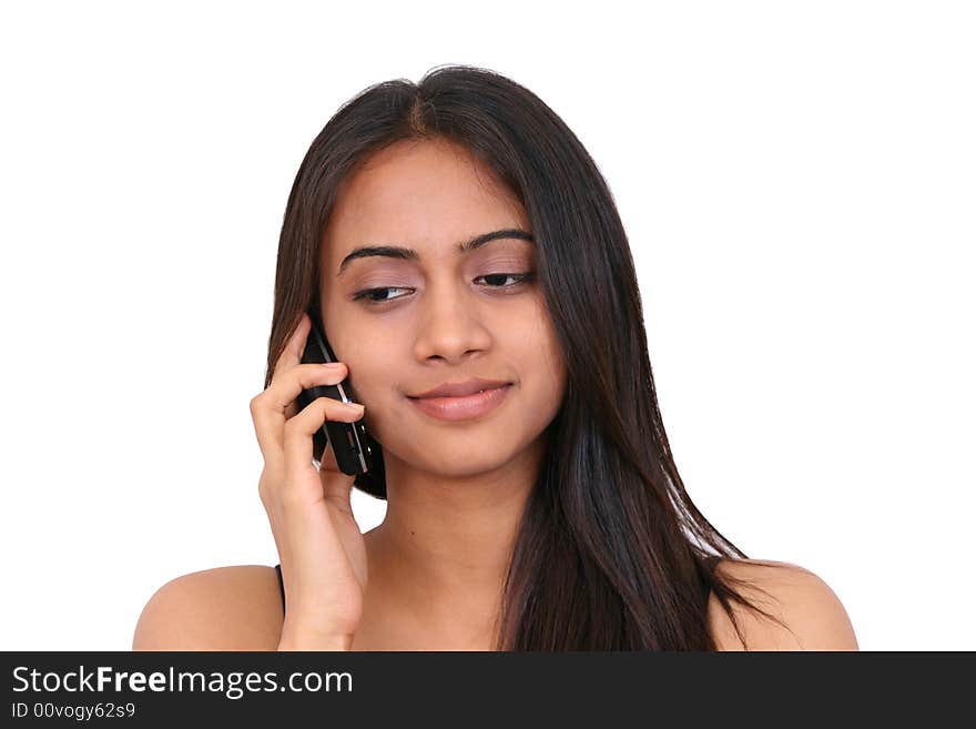 Teenage girl talking on phone. Isolated on white background.