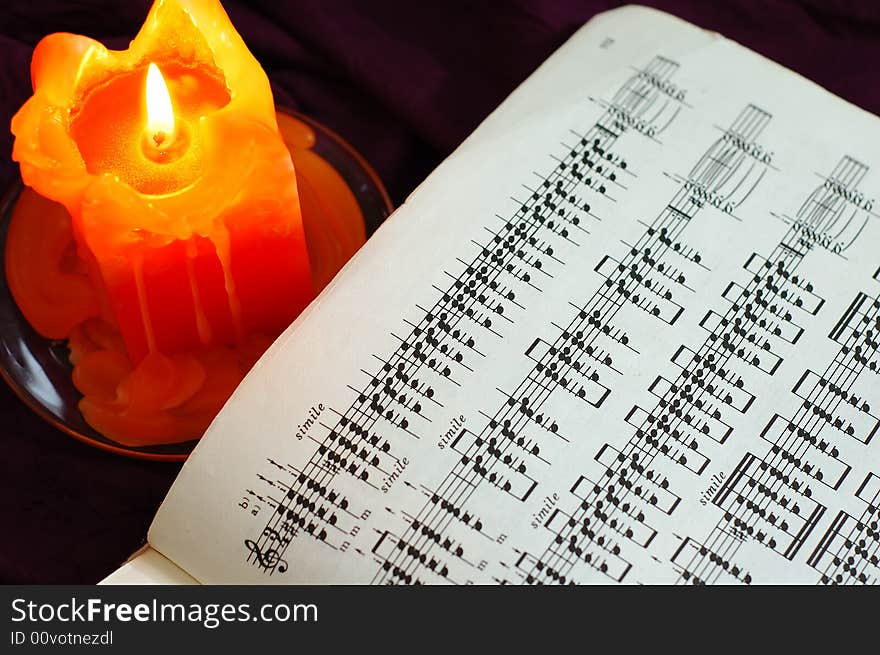 Candle with sheet music