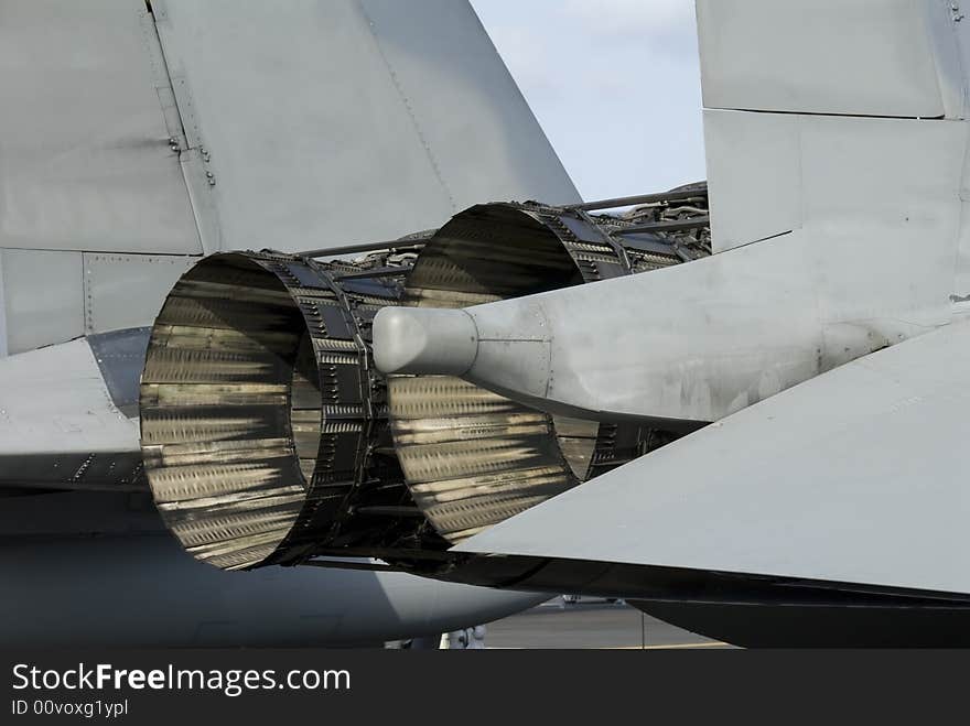 Rear detail with engine and afterburner of F-15 fighter aircraft. Rear detail with engine and afterburner of F-15 fighter aircraft.