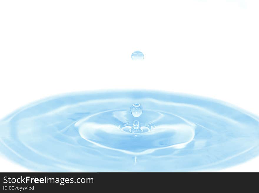 Blue water with falling drops on white. Use in your design!. Blue water with falling drops on white. Use in your design!