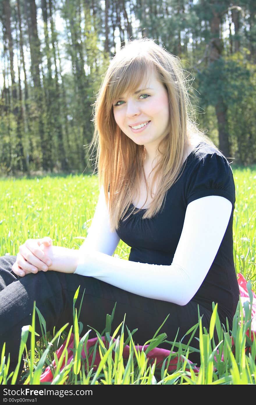 Portrait of a beautiful woman in a grassfield