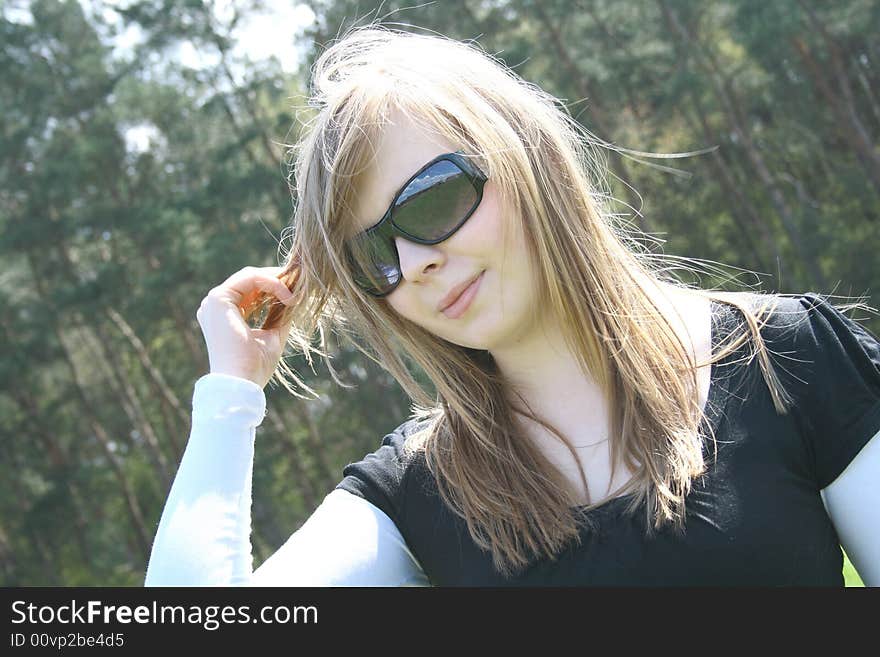 Portrait of a beautiful woman in a grassfield