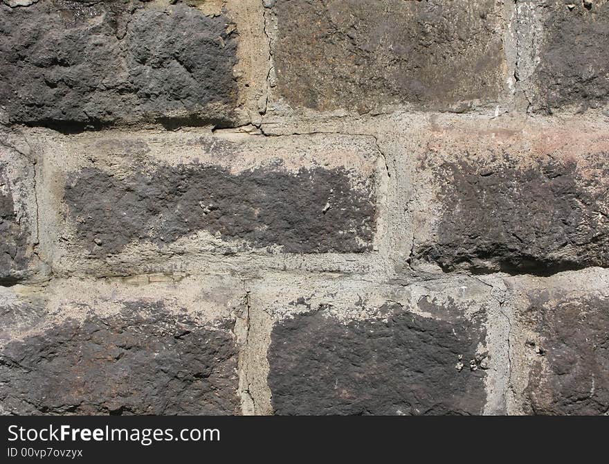 Piece of rough large stone wall texture. Piece of rough large stone wall texture