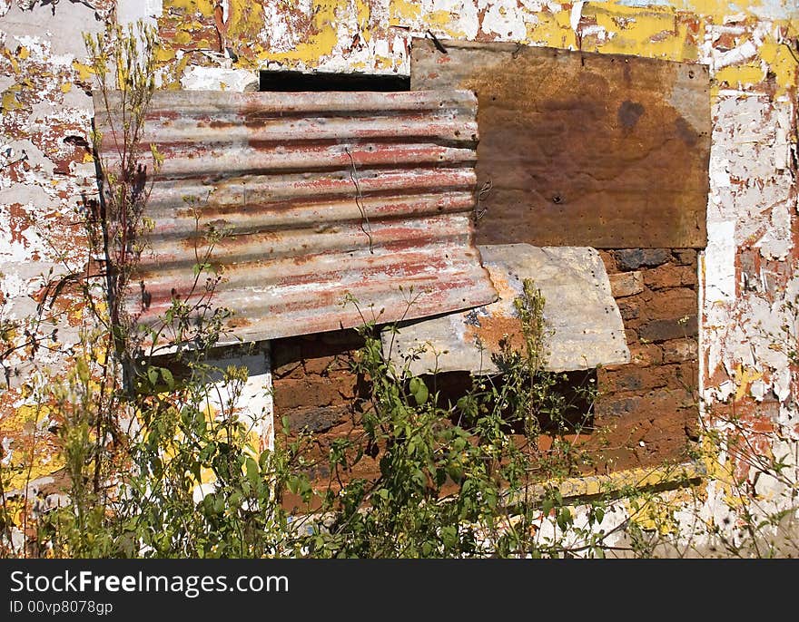 Window shutters on a derelict farm house near carletonville south africa