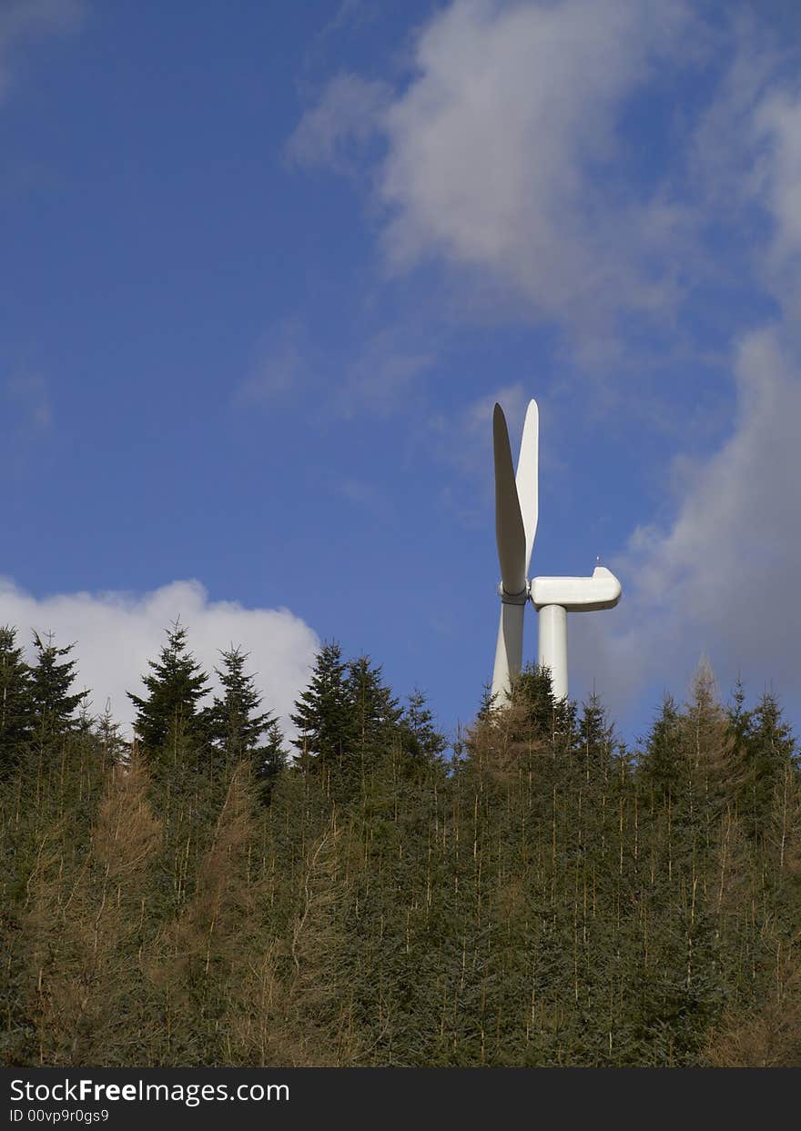 Wind turbine behind trees, Lammermuir Hills, East Lothian, Scotland