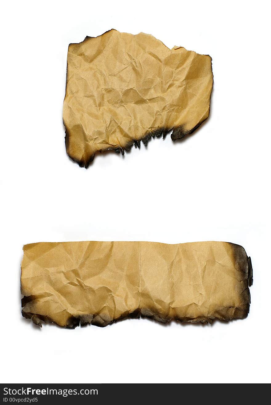 Two pieces of wrinkled and burned paper.  White background. Two pieces of wrinkled and burned paper.  White background