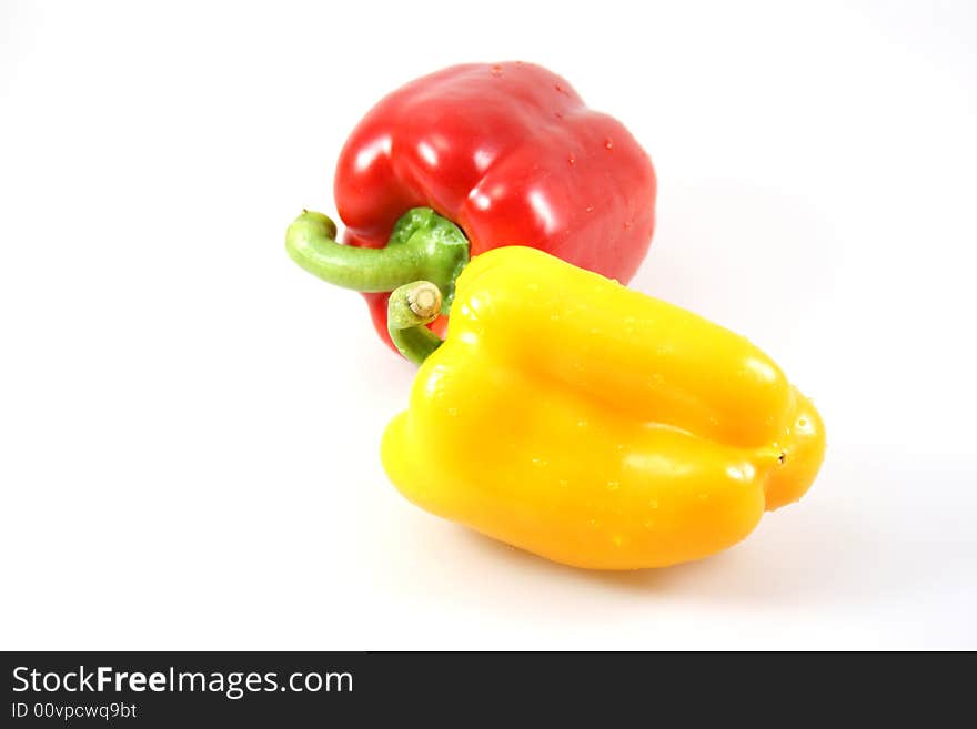 Isolated red and yellow paprikas