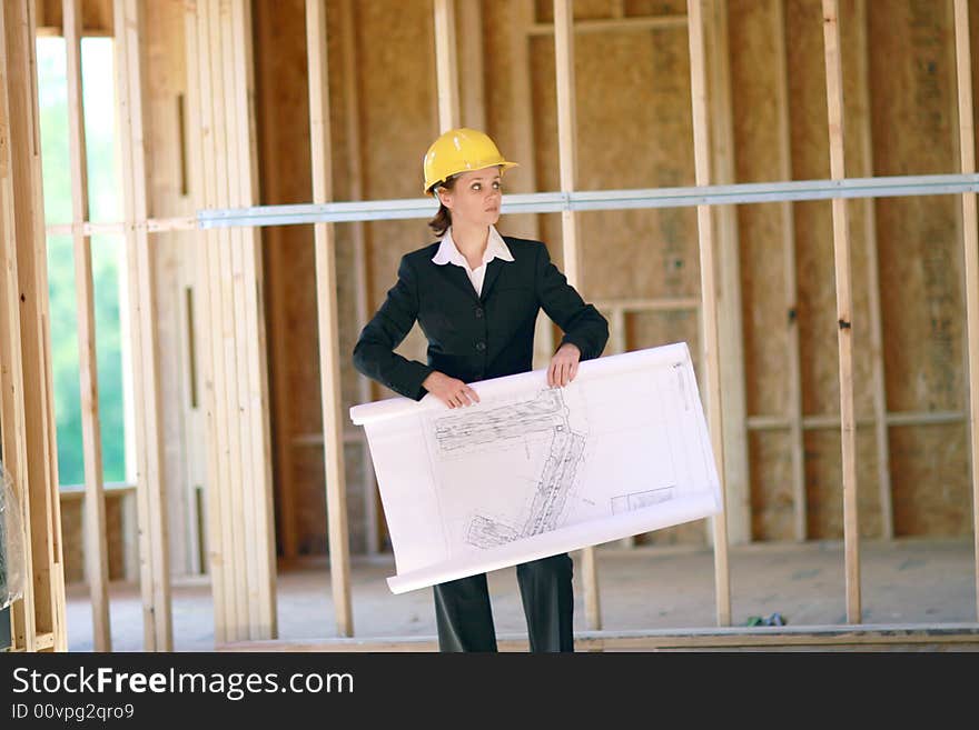 Young female architect at construction site