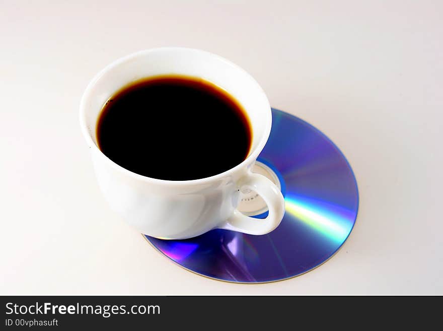 Cup of coffee with dvd disc