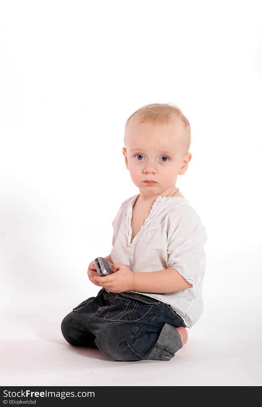 Sad baby with phone isolated on white