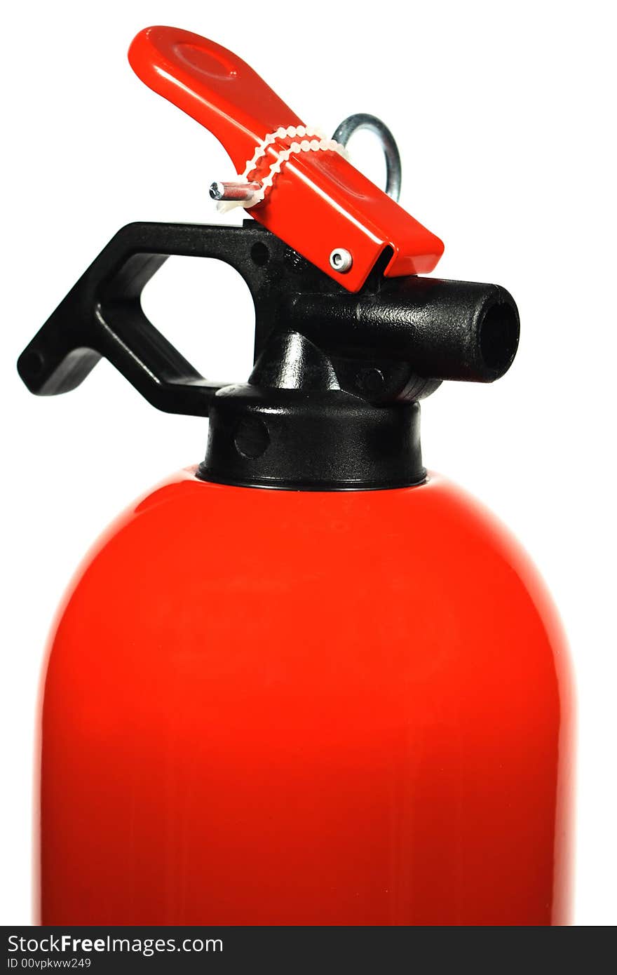 Close - up of fire extinguisher over white.