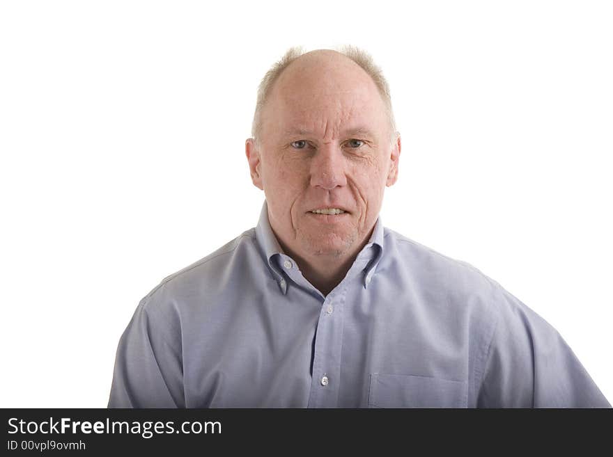 An aging baby boomer in a blue dress shirt on a white background. An aging baby boomer in a blue dress shirt on a white background