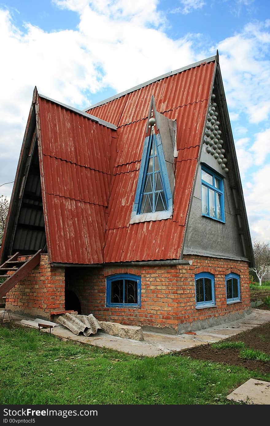 Small original country house and blue sky