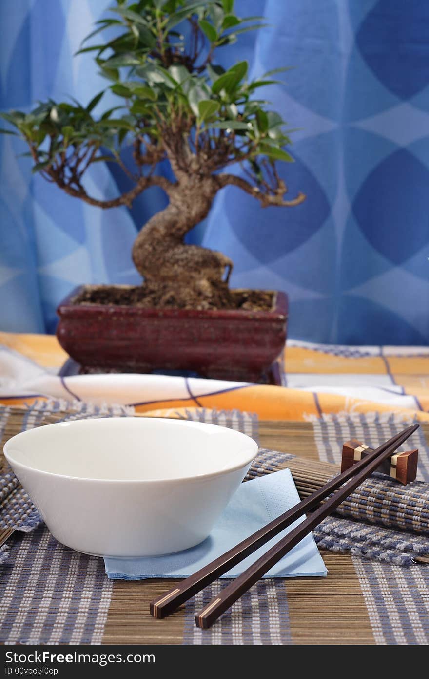 Asian style decorated table, soup bowl in the foreground