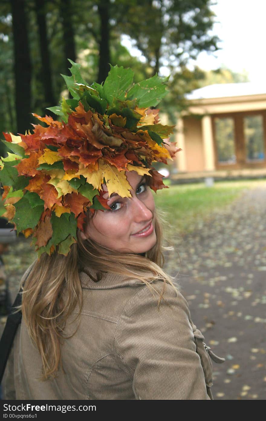 Girl in a wreath from maple leaves