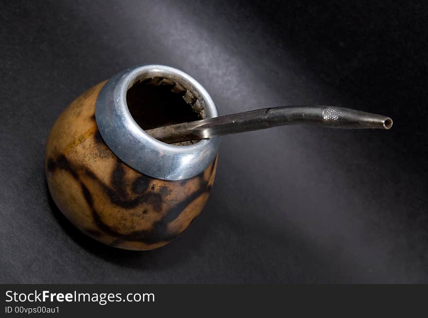 Сup from calabash with yerba mate tea and straw. Сup from calabash with yerba mate tea and straw.