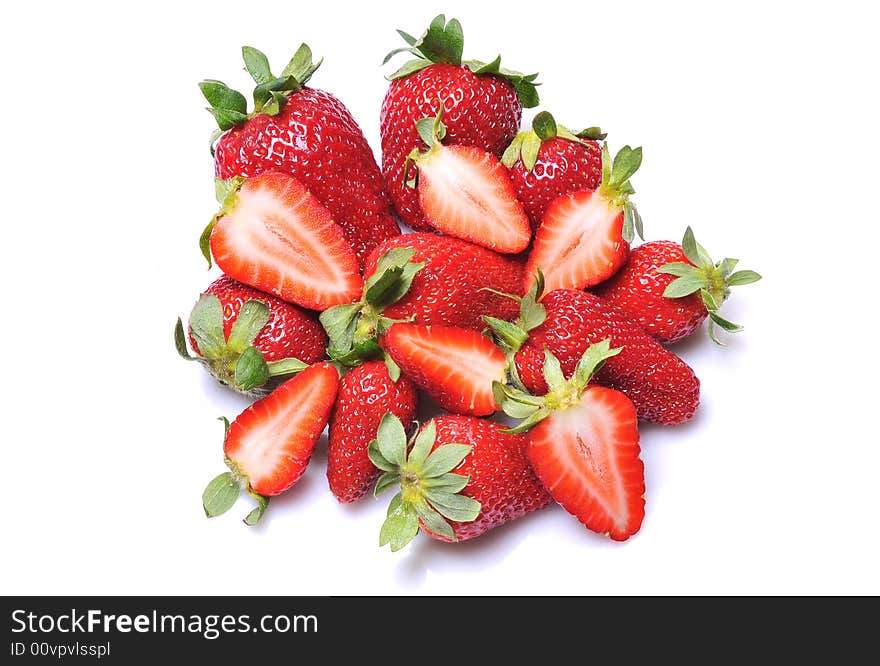 Close up of a group of fresh, succulent strawberries on white background