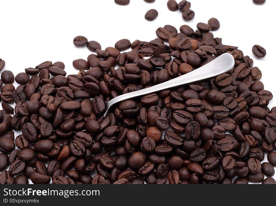 Cofee seed in a cup isolated on a white background