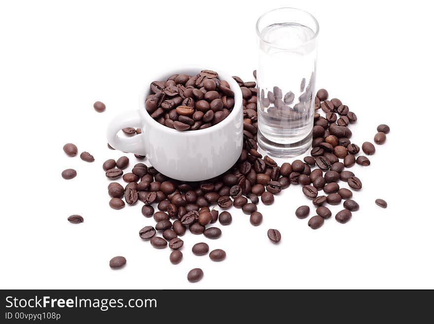 Cofee seed in a cup isolated on a white background