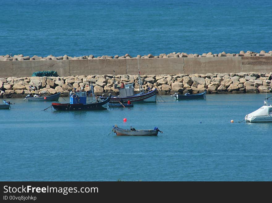 Blue Fishing boats in harbor