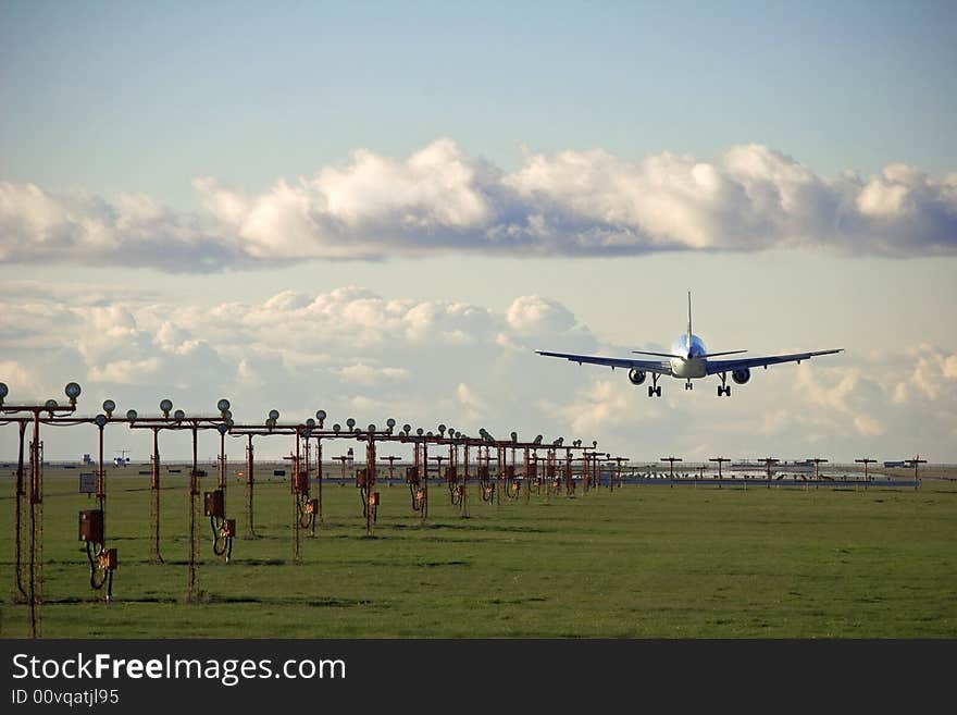 Commercial airliner prepares to land at airport. Commercial airliner prepares to land at airport