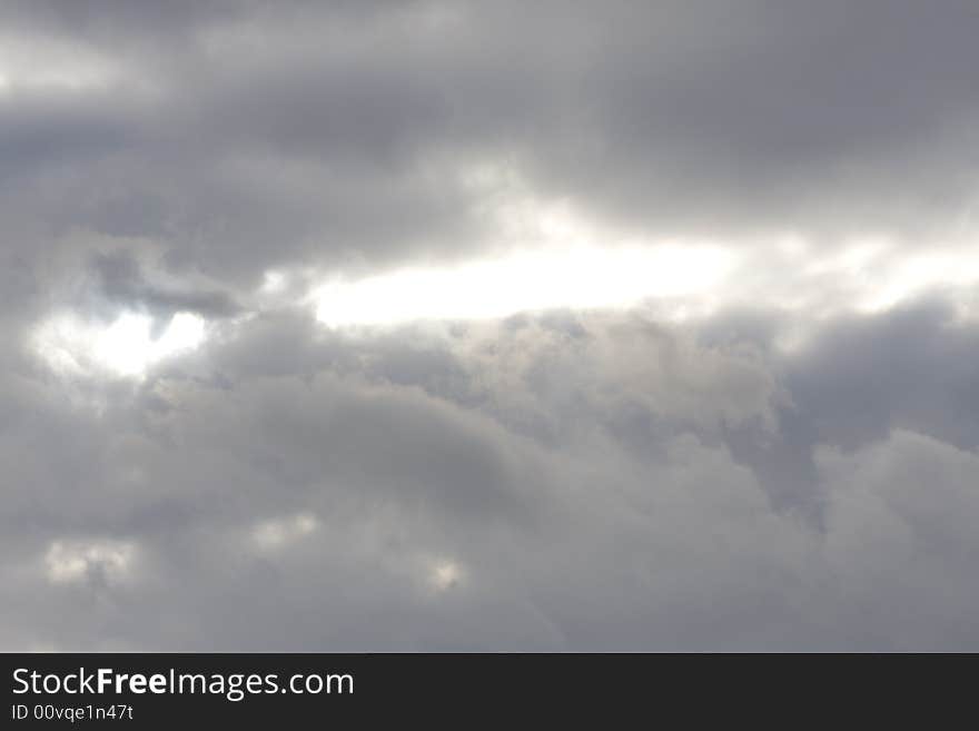 Grey Clouds before a Storm with a Glimpse of Sunshine. Grey Clouds before a Storm with a Glimpse of Sunshine