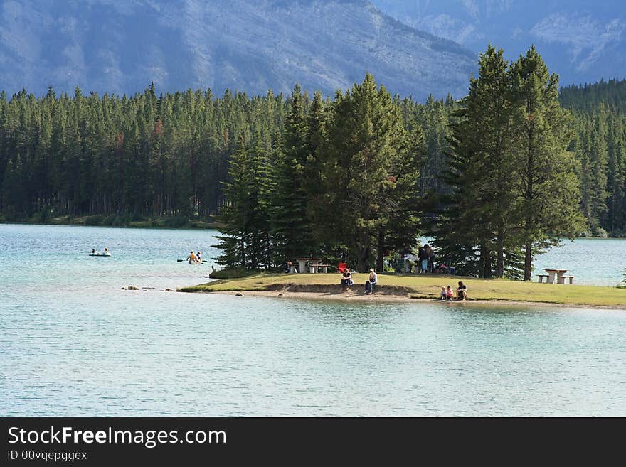 People enjoying a warm summer day at the lake. People enjoying a warm summer day at the lake