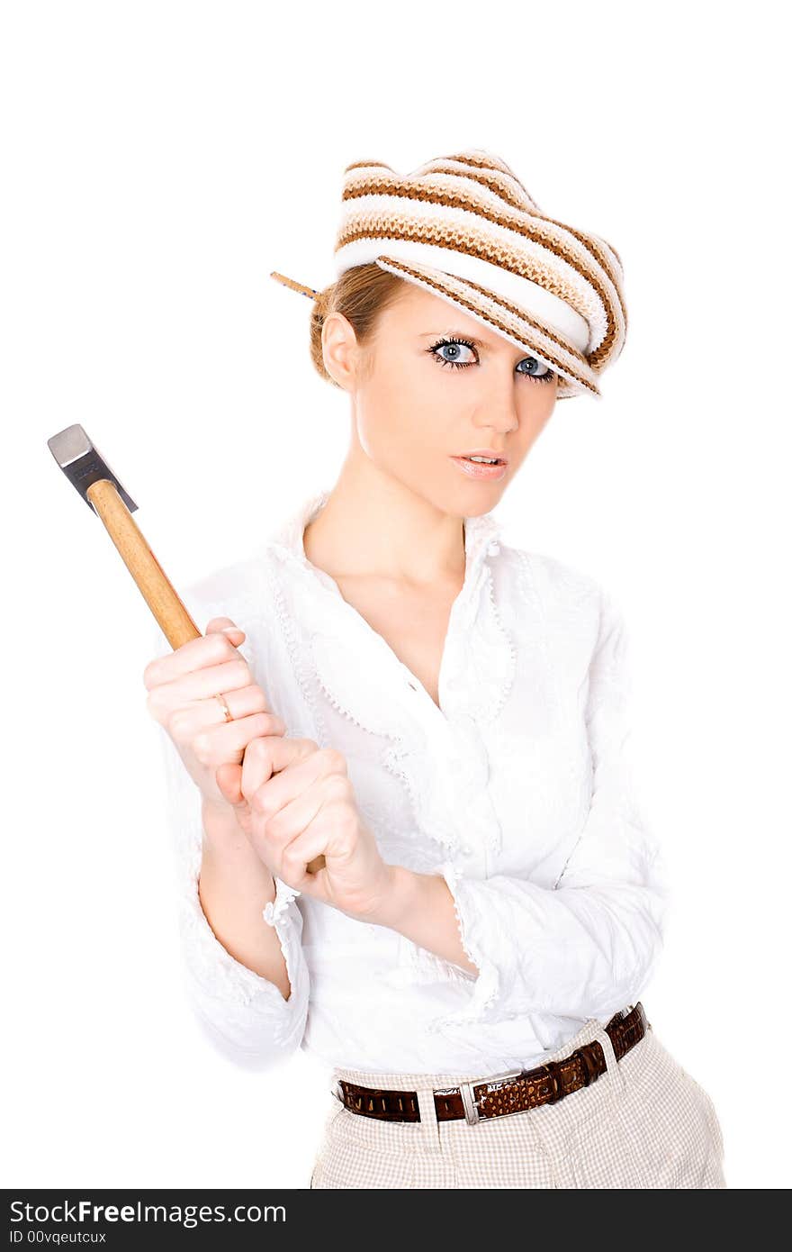 Cute businesswoman in cap with a hammer on white background. Cute businesswoman in cap with a hammer on white background