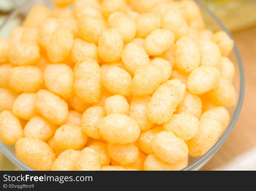 Yellow corn chips in a glass plate